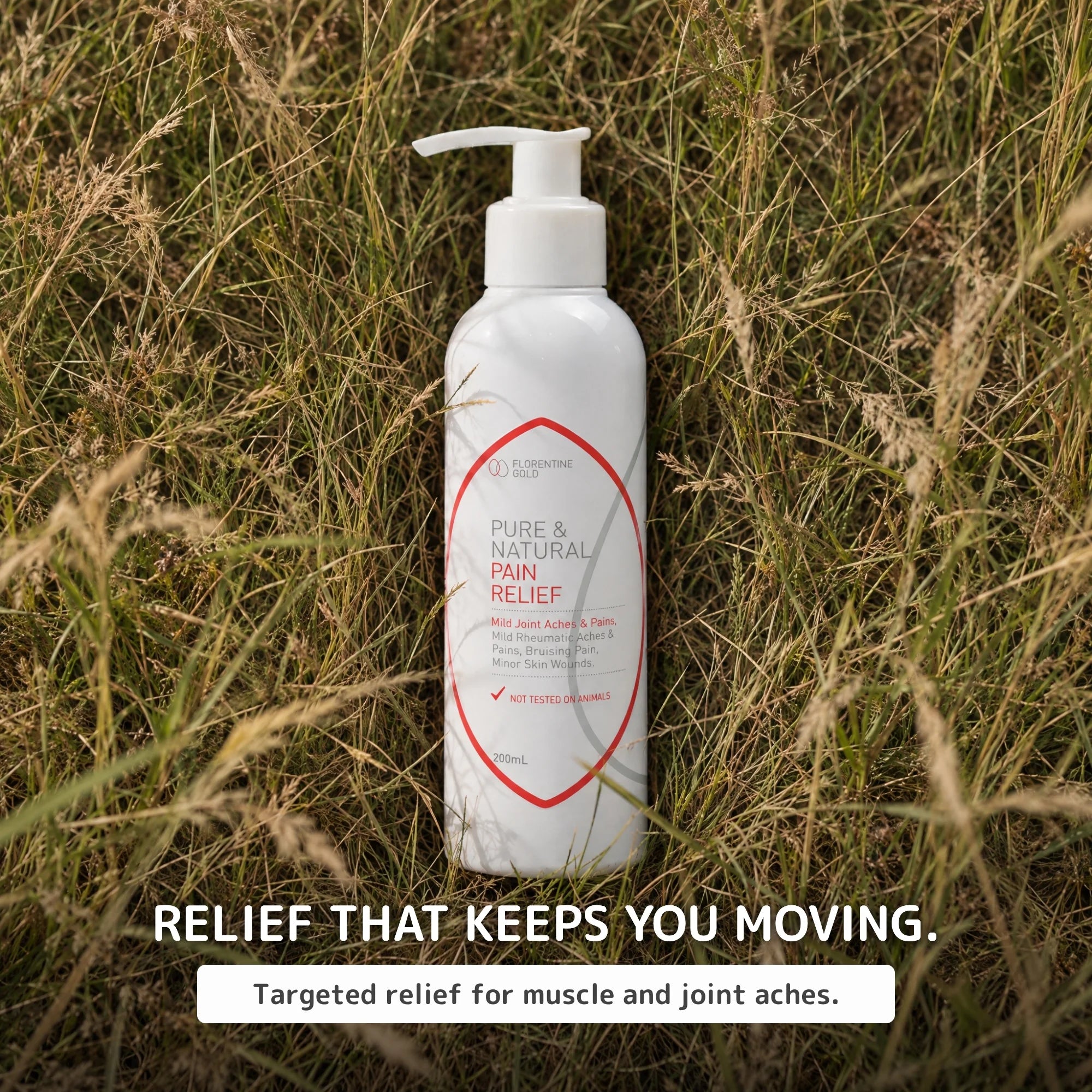 A white pump bottle labeled 'Pure & Natural Pain Relief Cream' stands upright in tall dry grass outdoors. Text below reads 'RELIEF THAT KEEPS YOU MOVING.